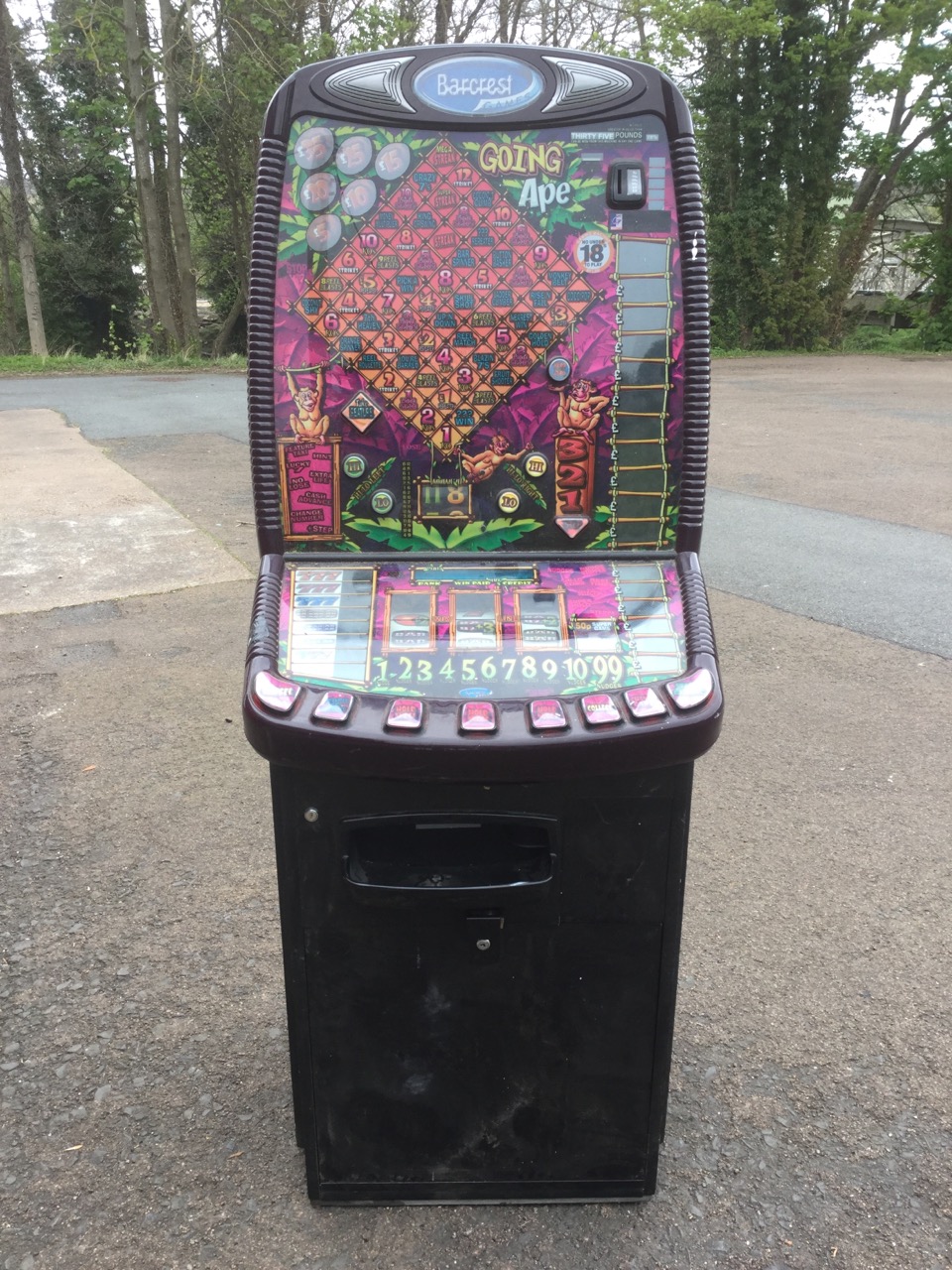 A Barcrest fruit machine - Going Ape, the ribbed frame with standard glass panels exhibiting