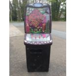 A Barcrest fruit machine - Going Ape, the ribbed frame with standard glass panels exhibiting