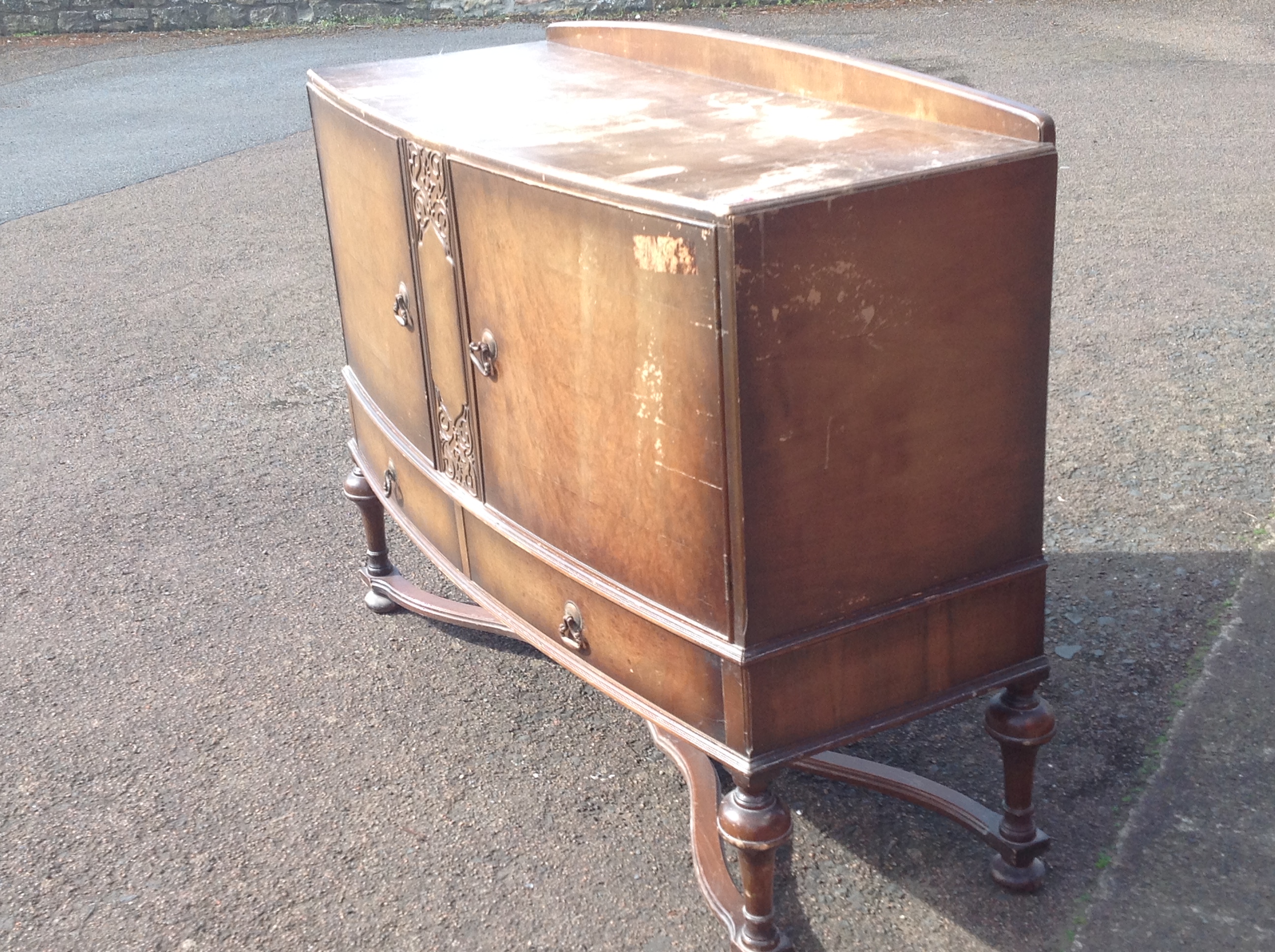 A bowfronted walnut sideboard, the moulded top above central carved panel flanked by panelled - Image 3 of 3