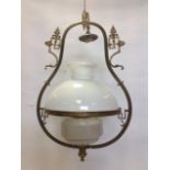 A Victorian hanging oil lamp, the brass frame with greek key decoration hung by chain from ceiling