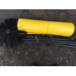 A set of flexible draining or chimney rods; and a roll of garden plastic. (2)