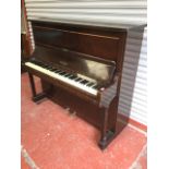 A mahogany cased piano by Welmar with seven octave keyboard on square column supports, having