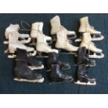 A collection of leather skating boots in black and white with Sheffield steel blades, various makers