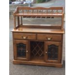 A French oak sideboard, the back with spindle gallery above a shelf supported on bobbin turned