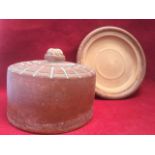 An early terracotta cheese dish & cover, with moulded base and pierced lid incised with cobweb style