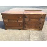 A pair of 50s oak chests, each with two drawers and ribbed decoration mounted with rosette