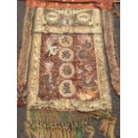 A nineteenth century Chinese banner sewn with embroidered panels and characters in coloured & gilt