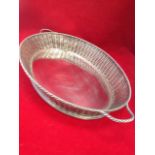 A large oval silver plated basket tray by Leuchars & Sons, with plaited basketweave style flared