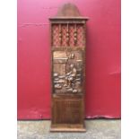 An oak stick box with shaped back above a lifting moulded lid, the front with gallery spindles above