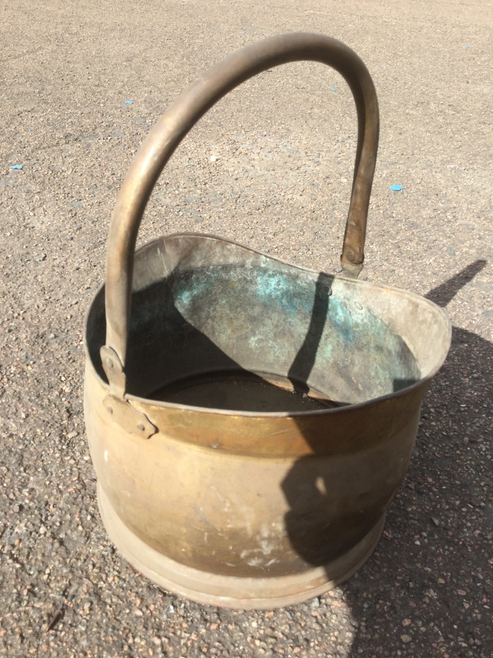 A brass helmet shaped coal skuttle with rolled rim and swing handle; and another similar smaller. ( - Image 3 of 3