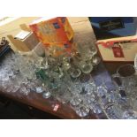 A large quantity of drinking glasses including tumblers, wine, sherry, liqueur, some sets, brandy