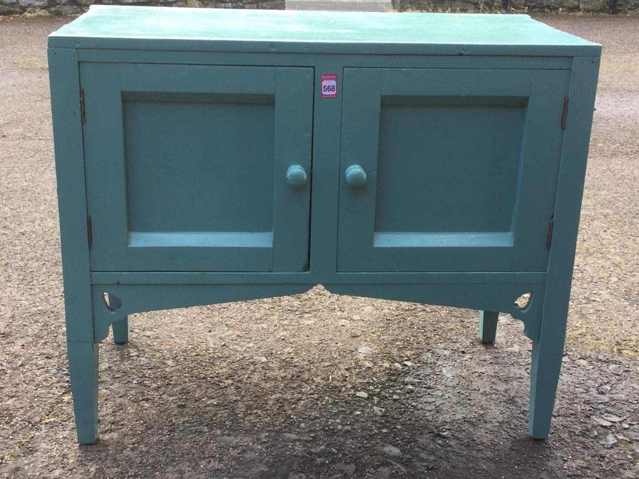 A painted washstand with panelled cupboard doors above aprons pierced with heart motifs, raised on - Image 3 of 3