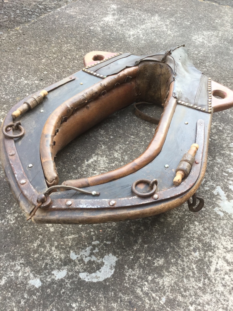 A large leather horse collar, the wood frame with iron mounts and rings with brass studding, - Image 2 of 3