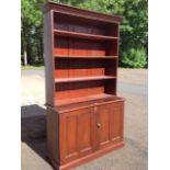 A Victorian mahogany bookcase, the top with moulded cornice above open adjustable shelves, above a