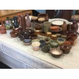 A quantity of stoneware ceramics including studio pottery, salt glazed, crocks, kitchen storage