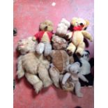 A collection of seven vintage plush teddy bears - Chad Valley, black & white, glass eyes, felt pads,