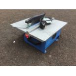 An electric tile cutter, with flat table calibrated platform.