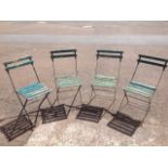 A set of four garden chairs with slatted backs & seats on folding iron frames. (4)