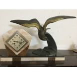 An art deco clock on marble plinth, with stylised bronzed bird signed I Rochard, the lozenge