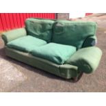 An Edwardian 'country house' drop-arm Howard style sofa, with down loose cushions, long seat, padded