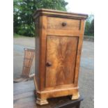 A walnut pot cupboard, the top with canted corners above a drawer and knobbed door, raised on