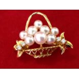 An 18ct gold pearl & diamond basket brooch