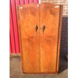 A 50s walnut wardrobe/compactum, with shaped crossbanded doors enclosing an interior with hanging