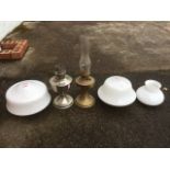 Two vintage oil lamps; and three milk glass light enclosures. (5)