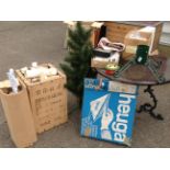 A Christmas tree with stand and a quantity of decorations, baubles, etc; a box of wallpaper rolls