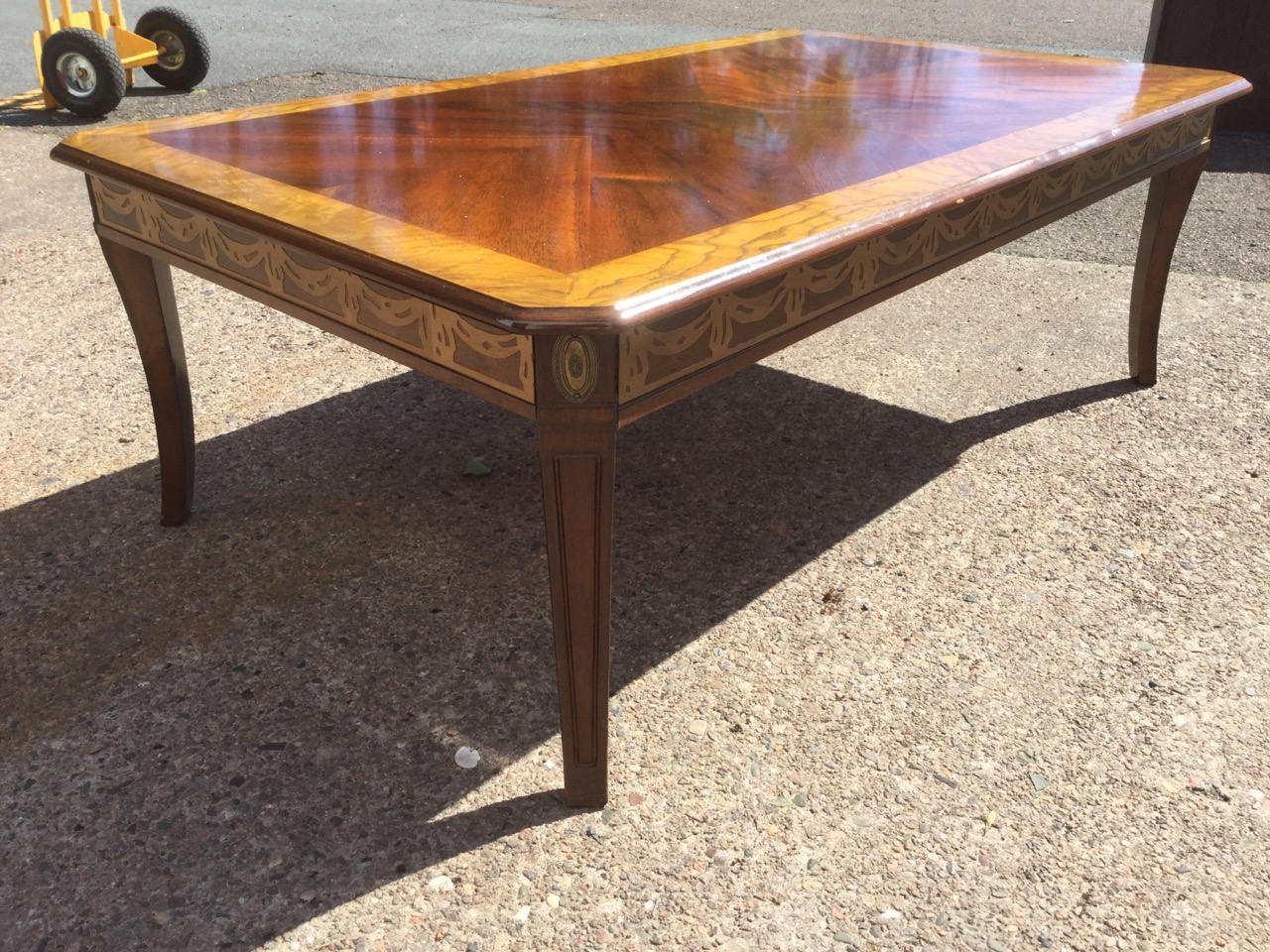 A walnut coffee table, the quarter veneered crossbanded top with canted corners above a frieze - Image 2 of 3