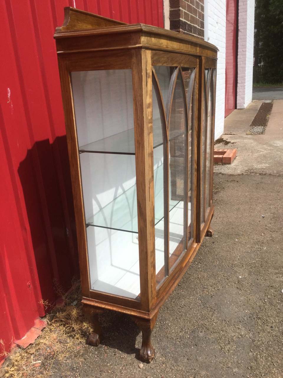 An oak bowfronted display cabinet with shaped upstand to moulded top above gothic astragal glazed - Image 2 of 3