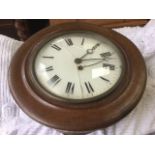 An oak cased wallclock, the cushion moulded case with convex glass and brass bezel enclosing a