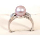 A boxed 18ct gold pink pearl & diamond ring.