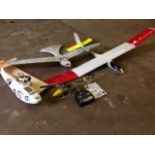 A radio controlled helicopter with instructions; a battery powered gliding bird; a glider style