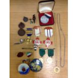 Various medals and brooches including a 9ct gold domino medallion, enamelled, mainly from the 30s,