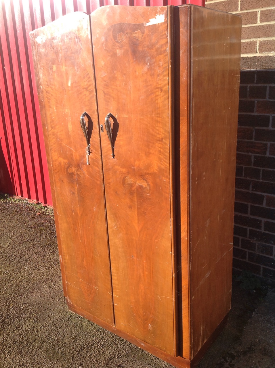 A 50s walnut wardrobe/compactum, with shaped crossbanded doors enclosing an interior with hanging - Image 2 of 3