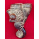 A pipe head, moulded as a stylised elephant with scraffito decoration, the ovoid burning chamber