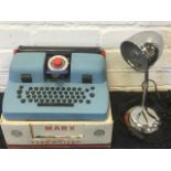 A boxed Mar Toys marx de luxe typewriter; and a deco style desktop chrome reading lamp. (2)