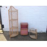 A bowfronted lloyd loom style bedside cabinet with open compartment above a cupboard; a cane