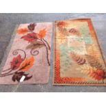 A hand-knotted brown fireside rug with leaf decoration; and a machine woven 50s rug of further