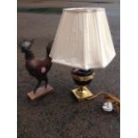 A gilded tablelamp with pleated shade, the vase with leaf collar on socle above brass plinth; and
