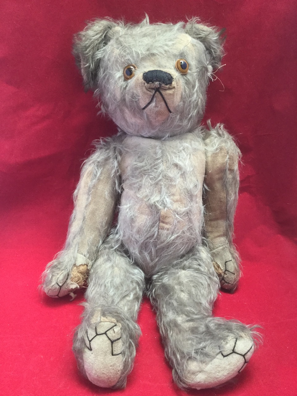 A large Edwardian plush bear, with stitched felt pads, articulated limbs and glass eyes, the snout - Image 3 of 3