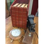 A leather bound compendium of London telephone directories, the four gilt tooled folders in tabletop