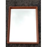 A hardwood framed mirror with bevelled plate.