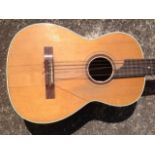 A classical guitar with cedar soundboard framed by inlaid trim, the soundhole crossbanded in