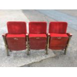 A row of three art deco theatre seats, with odeonesque gilt painted cast iron fan shaped ends,