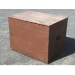 A large pine tongue & grooved boarded box with hinged lid, having carrying handles to ends.