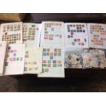 A stamp collection with pages from a loose-leaf album; as well as bags of loose unsorted stamps. (