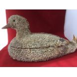 A carved wood box & cover in the form of a duck, with applied exotic shell decoration, mounted