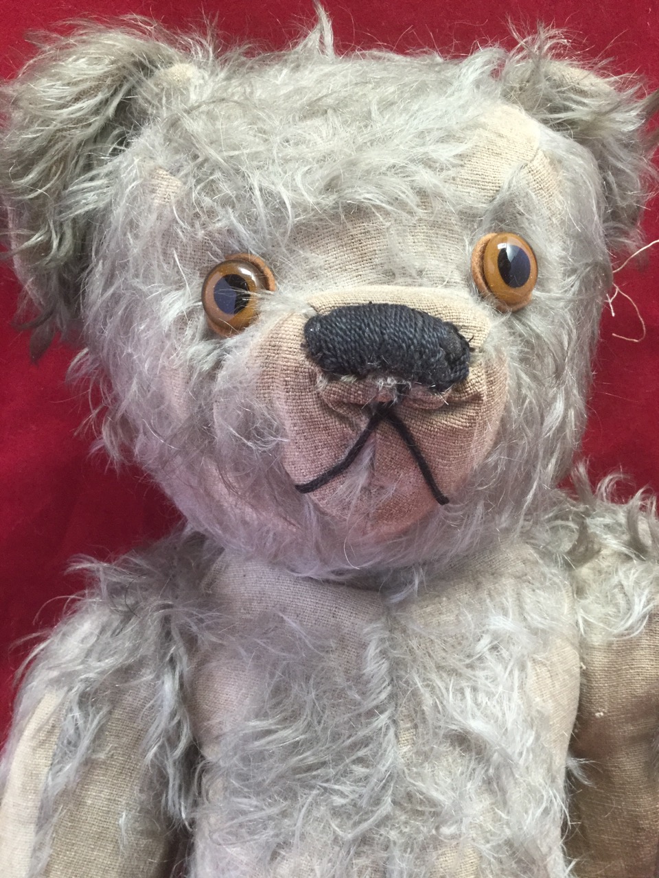 A large Edwardian plush bear, with stitched felt pads, articulated limbs and glass eyes, the snout - Image 2 of 3